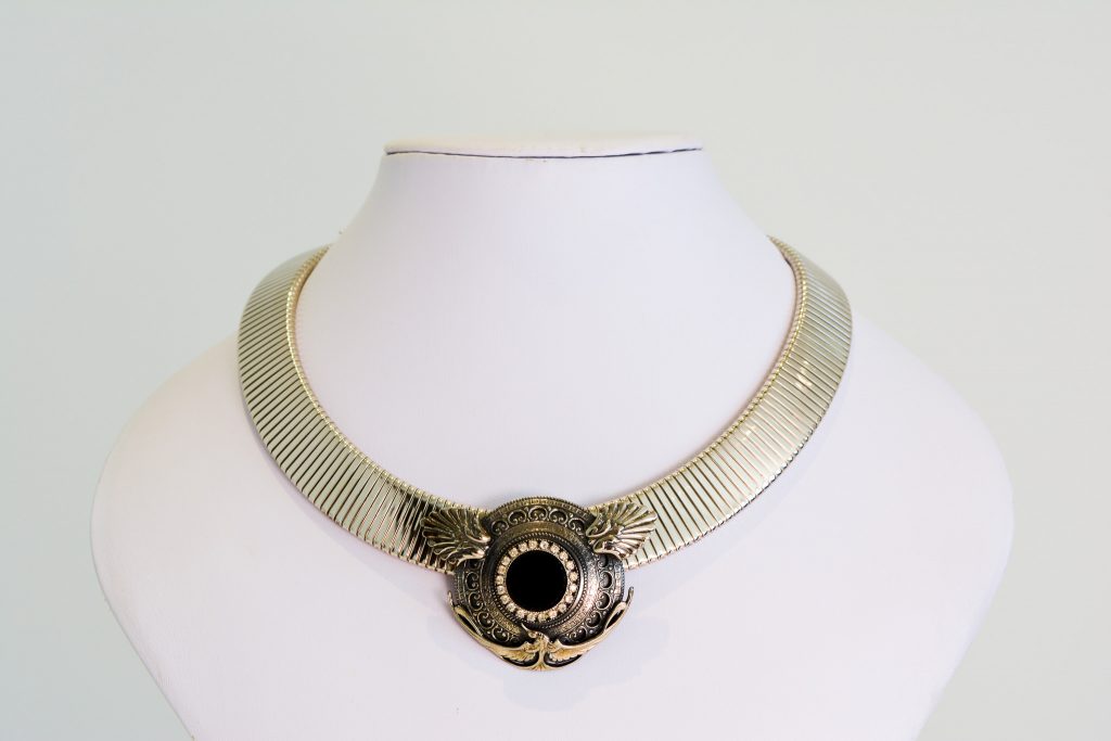 A vintage necklace in the Art Deco style with bird detail