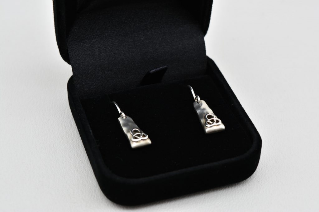 Silver earrings with wires for pierced ears. Celtic knot design.